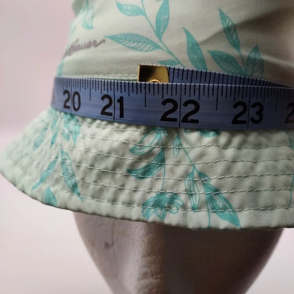 Women's Eddie Bauer floral bucket hat in mint green with aqua blue leaf floral
